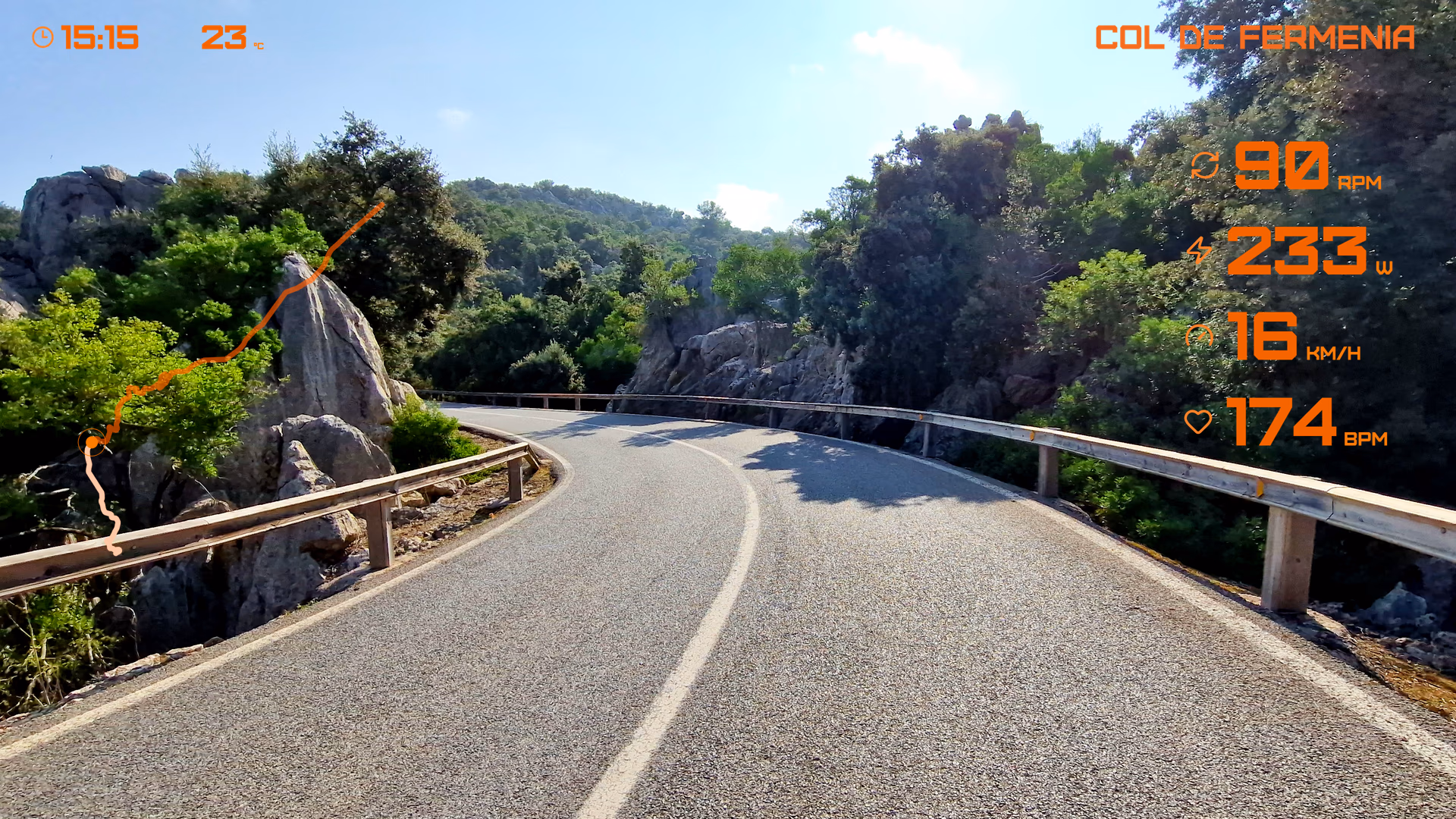Mountain road footage with orange route, cadence, power, speed, and heart rate widgets.